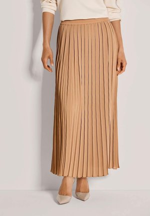 Faltender Midirock in hellem Tan mit weicher Textur, der einen elastischen Bund und vertikale Falten für fließende Bewegungen aufweist.