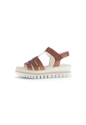 Brown leather sandals with multiple straps, a supportive back, and a thick white sole. Textured upper and cushioned footbed for comfort.