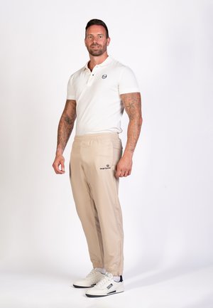 CARSON - Tracksuit bottoms - humus navy