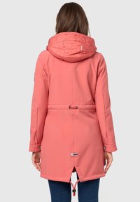 Long coral jacket with a quilted hood, adjustable waist, and two side pockets. Features buttoned cuffs and a logo patch on the back.