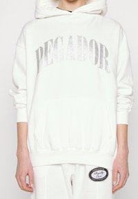 Pegador Jersey con capucha - white