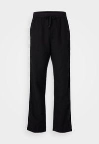 Pantalon en lin noir à coupe décontractée. Il présente une taille élastique avec un cordon de serrage et un design à jambes droites. Texture lisse, détails minimaux.