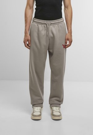SIRENE - Tracksuit bottoms - wet weather
