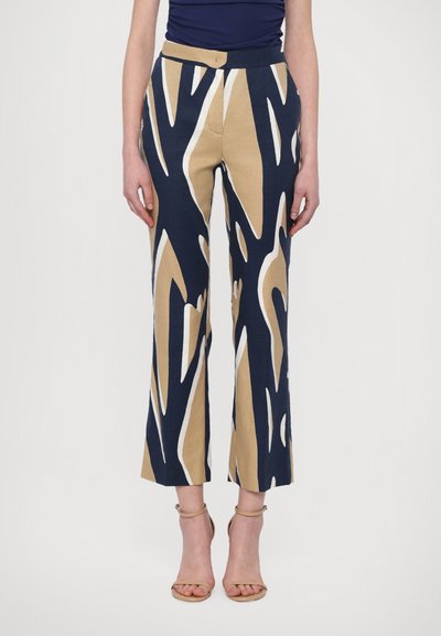 Wide-leg trousers in navy, beige, and white abstract print. Made from a lightweight fabric, features a smooth waistband and cropped length.