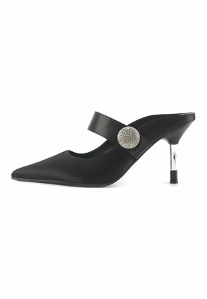 Black synthetic heeled mules with pointed toe, wide strap, and crystal-accented circular hardware. Features a metallic, transparent heel.