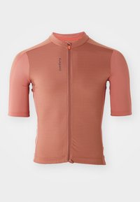 Maglia da ciclismo a maniche corte di colore rosa salmone con zip frontale, tessuto testurizzato, dettagli arancioni a contrasto e design aderente.