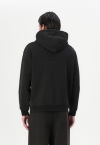 Marimekko SANOMA VIHKIRUUSU PLACEMENT UNISEX - Sportska majica - dark brown/grey