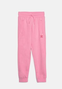 Rosa sweatpants i mjukt tyg, med elastisk midjeband, dragsnöre, sidfickor och en liten adidas-logotyp på vänster lår.