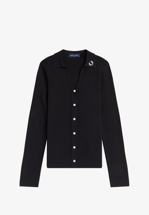 Cardigan noir à manches longues côtelé avec boutons blancs, col ouvert et petit logo de couronne de laurier blanche sur la pointe du col gauche.