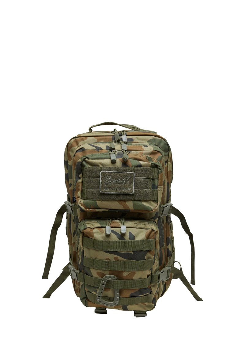 Kamuflāžas mugursoma ar vairākiem rāvējslēdzēju nodalījumiem, mīkstām plecu siksnām un augšējo rokturi. Strukturēta auduma ar nostiprinātām šuvēm.