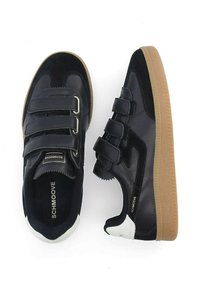 Black leather sneakers with suede accents, three adjustable velcro straps, and a gum rubber sole. Features a white heel accent and logo.