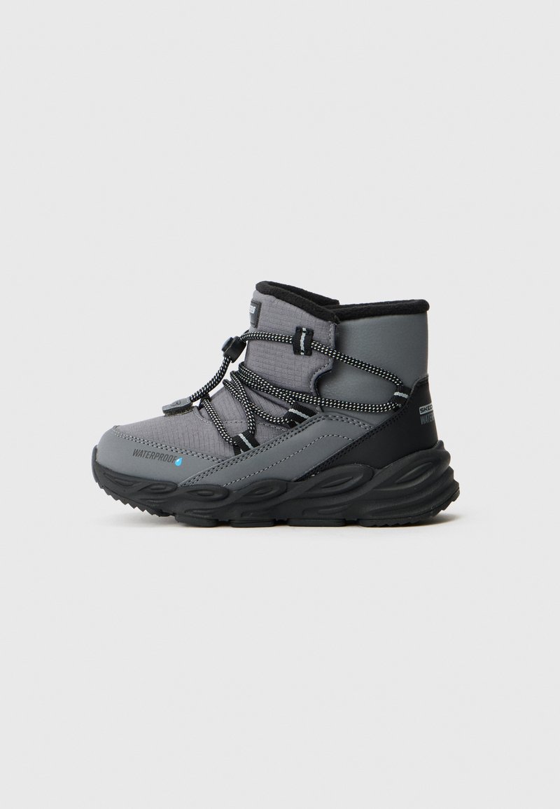 Gray waterproof ankle boot with textured fabric, black accents, elastic laces, and a thick rubber sole designed for traction.