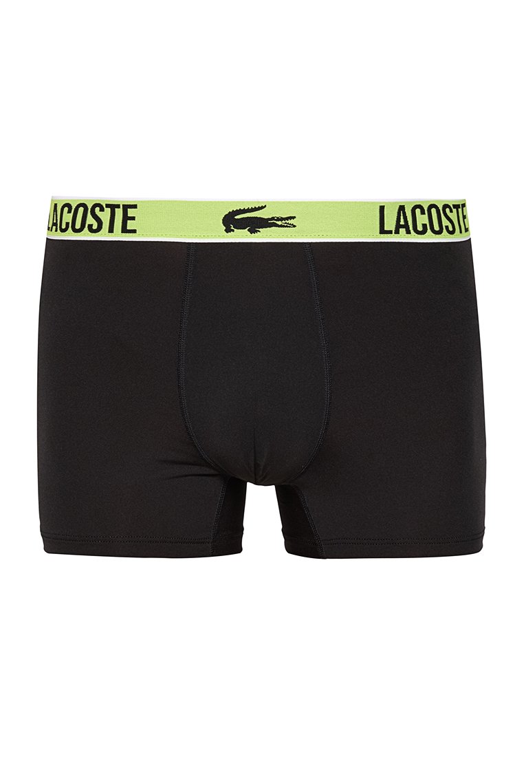 Czarne męskie bokserki z limonkowym pasem, z logo marki Lacoste i krokodylem umieszczonym na środku z przodu.