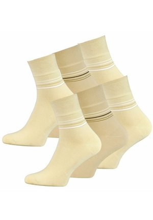 Set di quattro calze beige fino al ginocchio con strisce bianche e marroni a contrasto vicino alla parte superiore, realizzate in un tessuto traspirante e morbido.