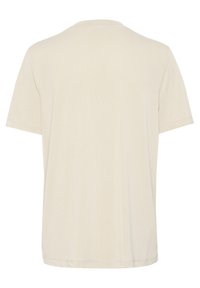 Beige bomulds T-shirt med rund hals, korte ærmer og en afslappet pasform. Har flade sømme og en glat tekstur på ryggen.
