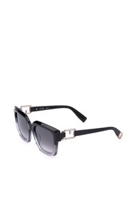 Lunettes de soleil carrées noires avec verres foncés dégradés et charnières métalliques dorées sur branches noires, montrées sur fond blanc.
