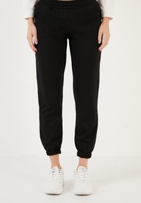 LELA Pantaloni de trening - black