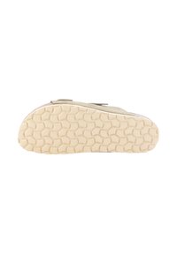 Suela de zapato hecha de goma color tan con un patrón de panal texturizado, que presenta una forma redondeada y una ligera curvatura en los bordes.