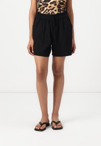 Black, linen blend shorts with an elastic waistband and side pockets, featuring a loose fit and casual style.