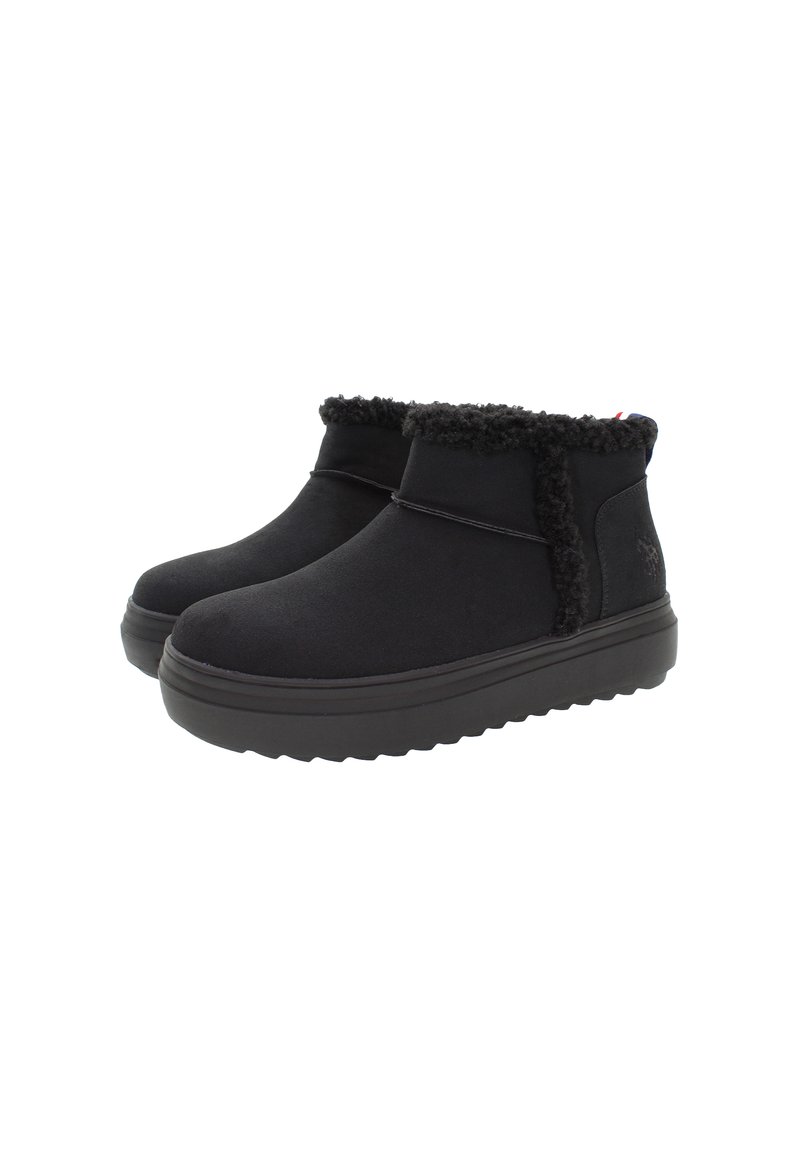 Ein Paar schwarze Knöchelstiefel mit dicken Gummisohlen und Fleece-Futter an den oberen Kanten, entworfen für Wärme und Komfort.