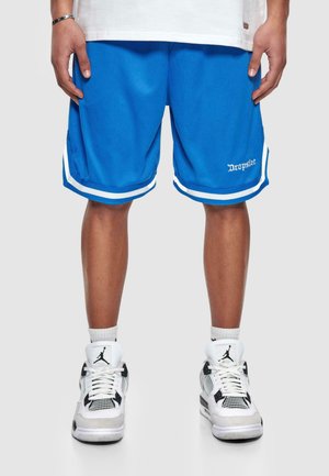 Blue athletic shorts with white accents, featuring a textured mesh material and contrasting side panels, paired with white and black sneakers.