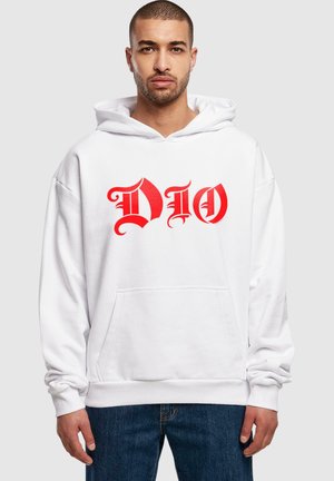 White hoodie with a front pocket and red graphic text "DIO." Smooth fabric, oversized fit, and elastic cuffs. Model wears blue jeans.