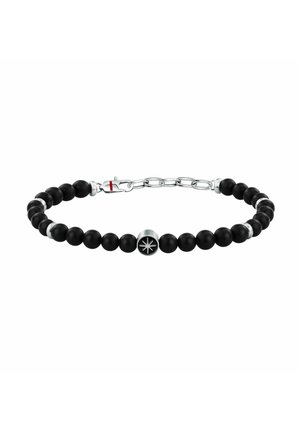 Braccialetto con piccole perline nere tonde e un ciondolo a forma di stella in argento al centro, più una catena e chiusura in argento.