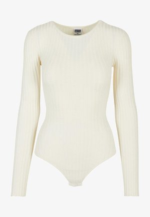 Langslavige, geribbelde bodysuit in zachte crèmekleurige stof. Heeft een ronde halslijn en een aangesloten silhouette met een laag uitgesneden rug.