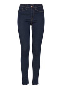 Jeans de corte ajustado fabricados en denim azul oscuro, con cierre de botón, cinco bolsillos y costuras naranjas en contraste. Textura suave.