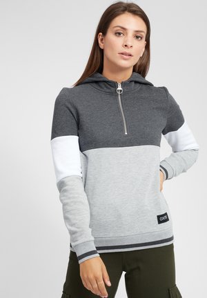 Sweat à capuche gris et noir avec fermeture éclair et design coloré. Il est confectionné en tissu doux, avec des poignets côtelés et une étiquette de logo.