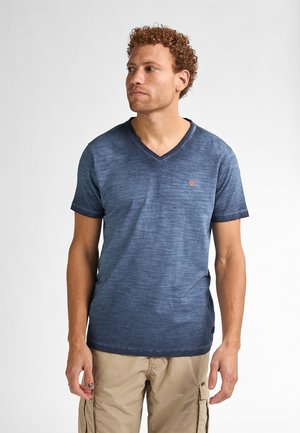 Navy blue v-neck t-shirt with a textured gradient, short sleeves, and a small red logo on the left chest. Crafted from lightweight fabric.