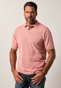 Korte mouwen polo in lichtroze, gemaakt van zachte katoen, met een drievoudige knoopsluiting en subtiele ribbelkraag en manchetten.