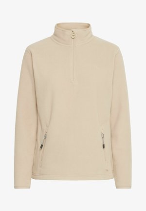 Pullover in pile beige con colletto alto, zip a metà e due tasche laterali; texture liscia e logo tonale semplice sul petto.