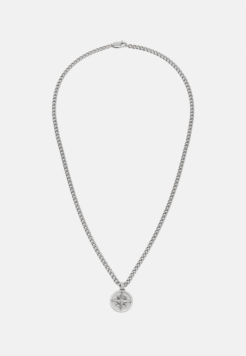 Silver chain necklace featuring a circular compass pendant with a star design, smooth texture, and a secure clasp.