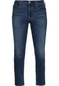Dark blue denim jeans with a slim fit, featuring a five-pocket design, a button fly, and subtle stitching details along the seams.