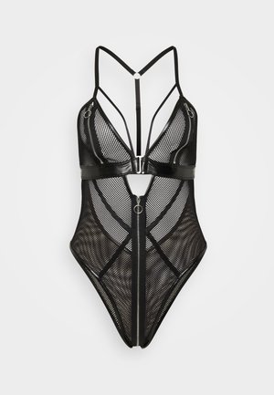 Black mesh bodysuit with triangular cups and adjustable straps. Features a central zipper and circular accents. Textured, form-fitting design.