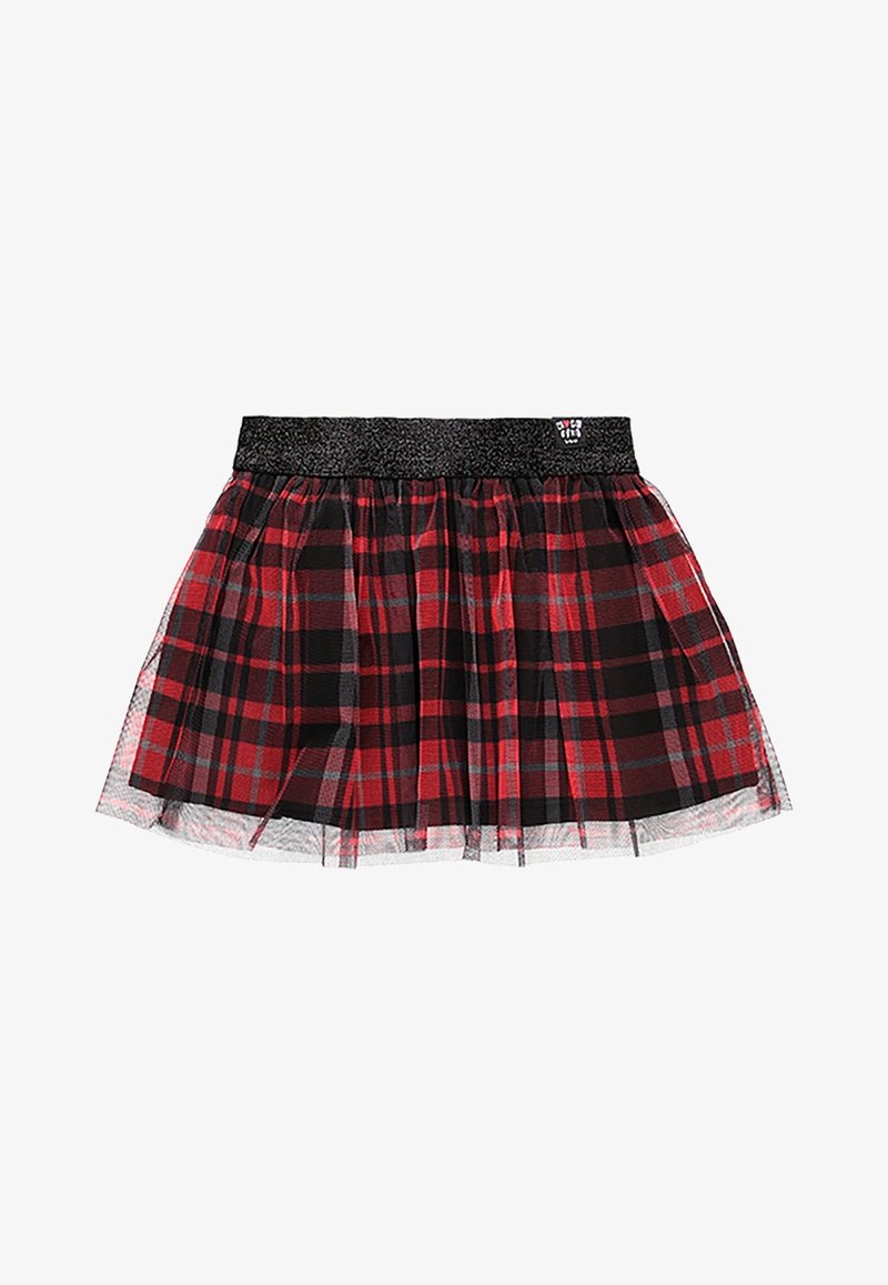 Jupe à carreaux rouge et noir avec une ceinture élastique noire pailletée, avec une superposition en tulle transparent et une petite étiquette sur la ceinture.