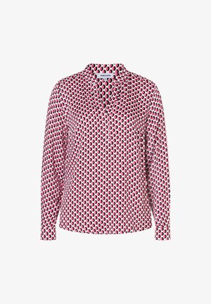 Long-sleeve blouse with pink, black, and white circular pattern, V-neckline, and cuffed sleeves, front view on white background.