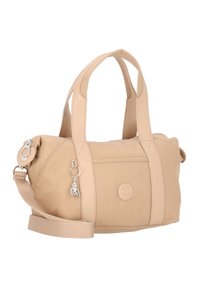 Borsa a mano in nylon beige con doppio manico corto e tracolla removibile. Presenta una chiusura con zip e un charm decorativo.