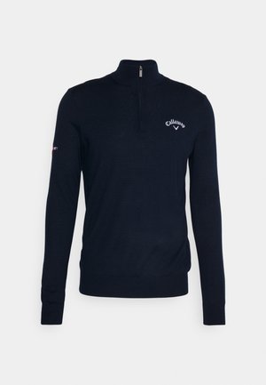 Navy zip-neck sweater made of soft fabric, featuring long sleeves, a fitted design, and an embroidered logo on the chest.