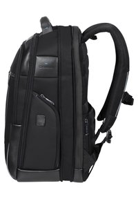 Zaino nero con sezioni imbottite, molteplici scomparti con zip, dettagli in rete e spallacci regolabili. Realizzato in materiale sintetico resistente.
