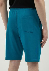 Calliope GINNICO - Pantalon de survêtement - verde