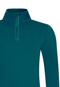 Teal gekleurde trui met lange mouwen, een opstaande kraag en een voorste halve rits met het woord "protest" verticaal.