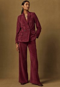 Next CORD WIDE LEG TROUSERS - Tygbyxor - burgundy red/röd - Zalando.se