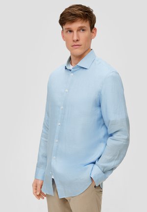 Lichtblauw langemouwen shirt van textuurstof, met een knoopsluiting aan de voorkant, een puntige kraag en een relaxte pasvorm. Ontworpen voor comfort.
