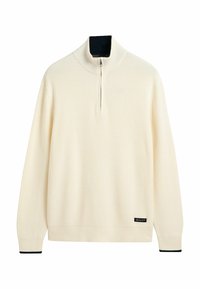 Sweter w kolorze kremowym z ryżowym wzorem i kołnierzem na pół-zamek, z długimi rękawami i granatowym akcentem przy kołnierzu. Metka z logo marki na dole.