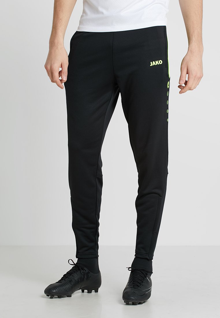 Schwarze Sportleggings aus einem dehnbaren Material mit schlankem Schnitt, grünen Akzenten und seitlichen Taschen für zusätzlichen Komfort.