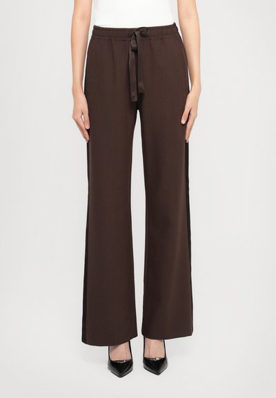 Brown wide-leg trousers with an elastic waistband and drawstring tie, featuring side pockets and a smooth, textured fabric.
