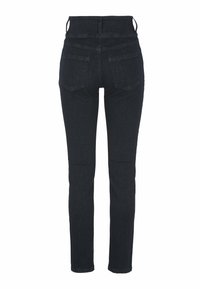 Mörkblå jeans med hög midja, slim fit och två bakfickor. Tillverkade av denimtyg med en slät yta och minimal sömnad.