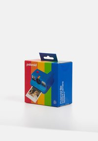 Polaroid Go instant camera packaging features a blue box with rainbow stripes, a camera illustration, and a photo print emerging from the front.